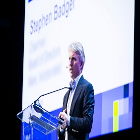 Director and former Chairman of the Mars Board, Stephen Badger, speaking on stage at a conference.